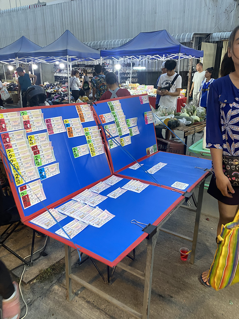 Market seller with lottery tickets