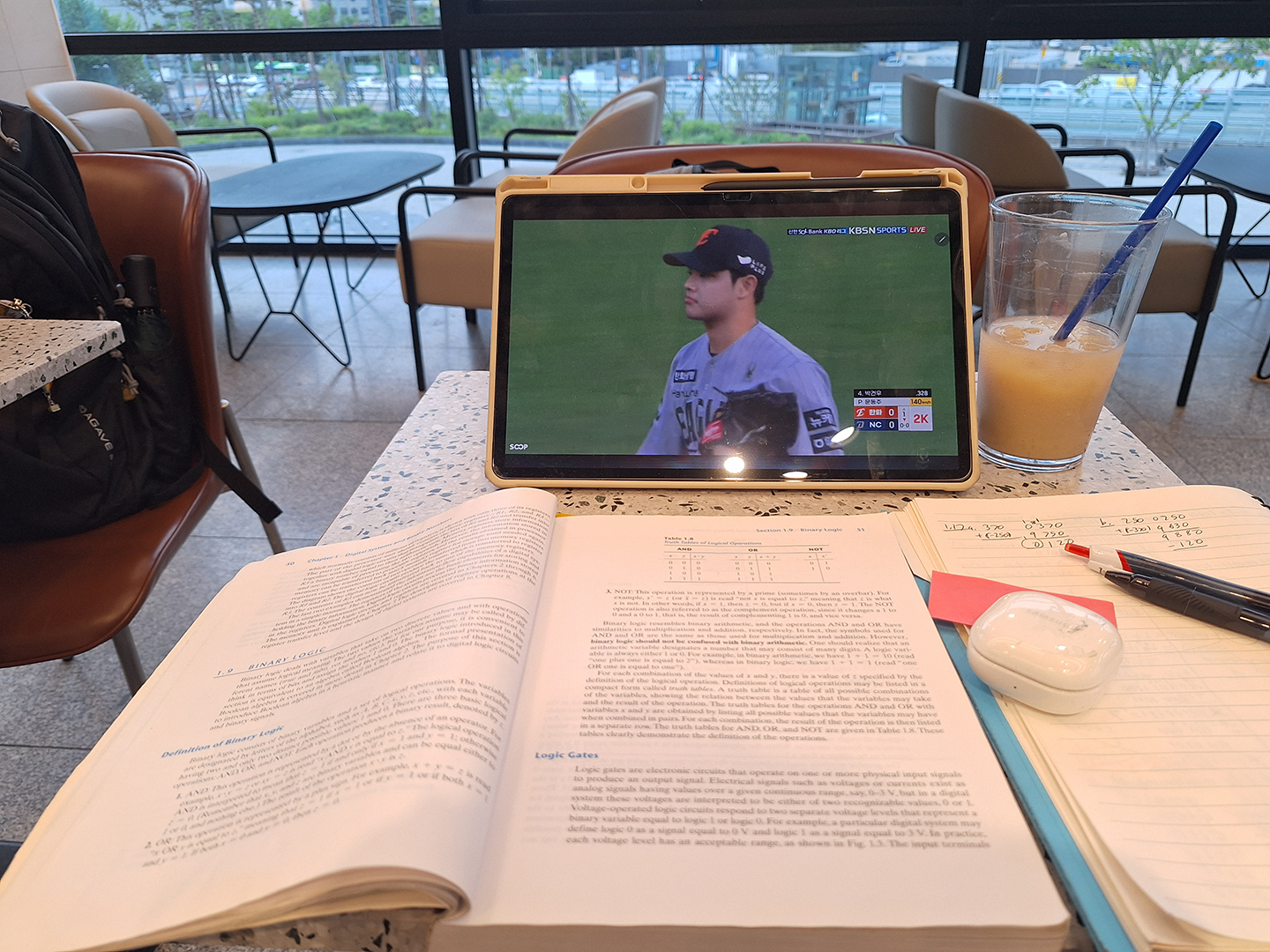 Photo of Camden's study materials in a cafe