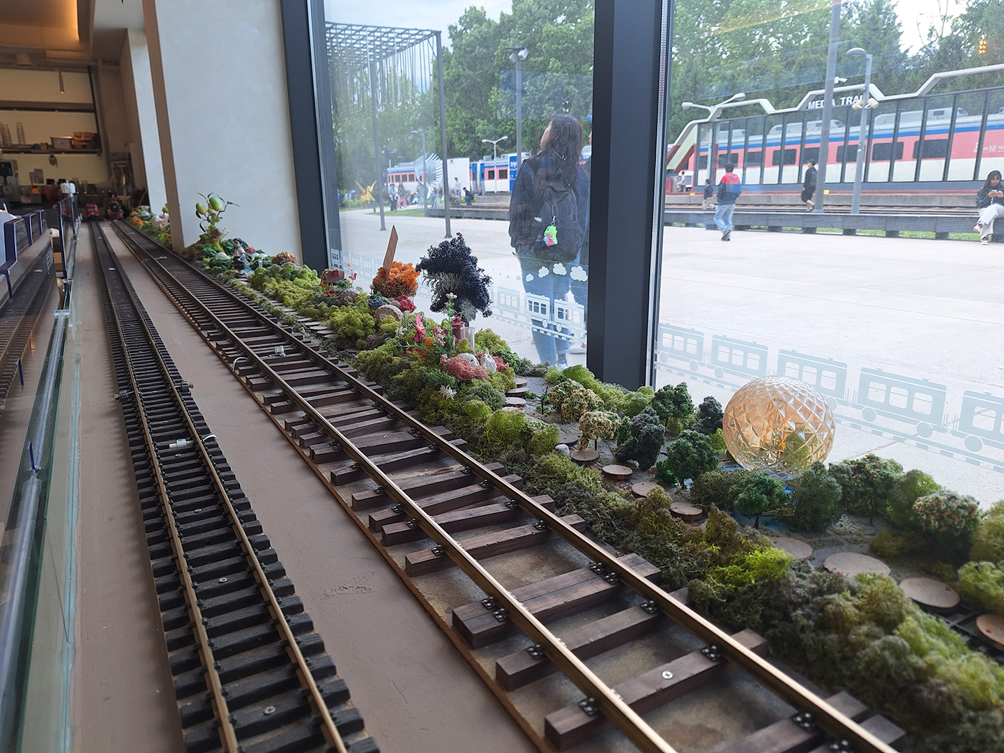 Train cafe with toy trains for delivering coffee