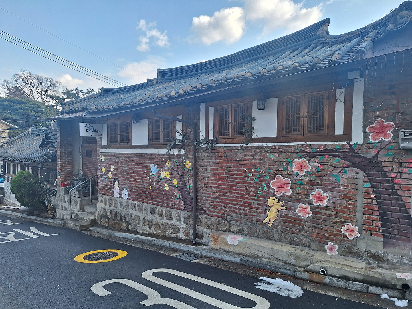 Bukchon Village Hanok with art on the walls