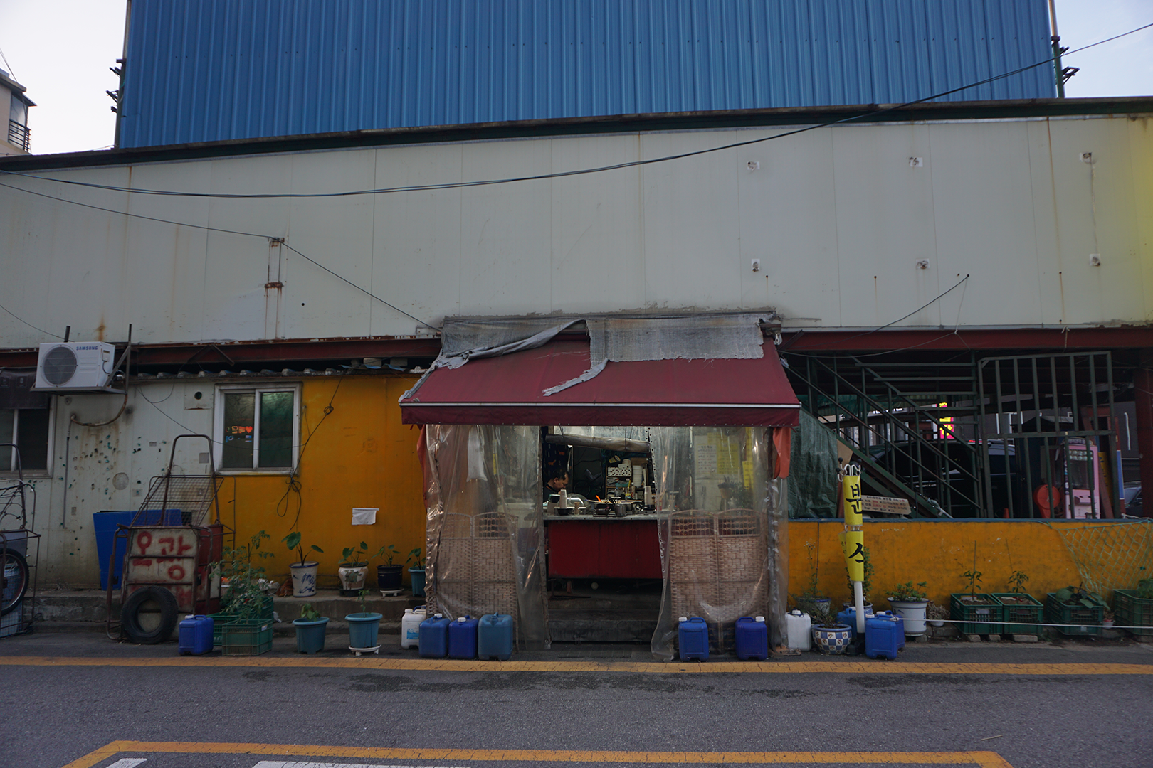 Market stall with old infrastructure around it