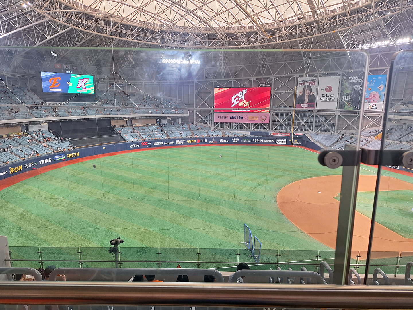 Inside a Dome Baseball stadium looking out from the bleachers on the 3rd base line