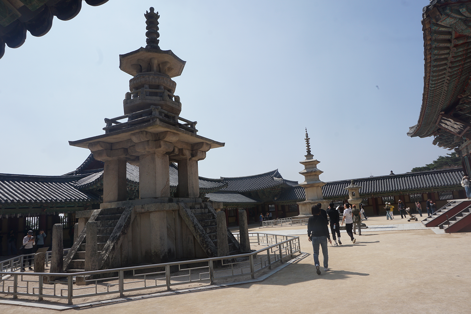 2 pagodas with distinct styles in courtyard of temple