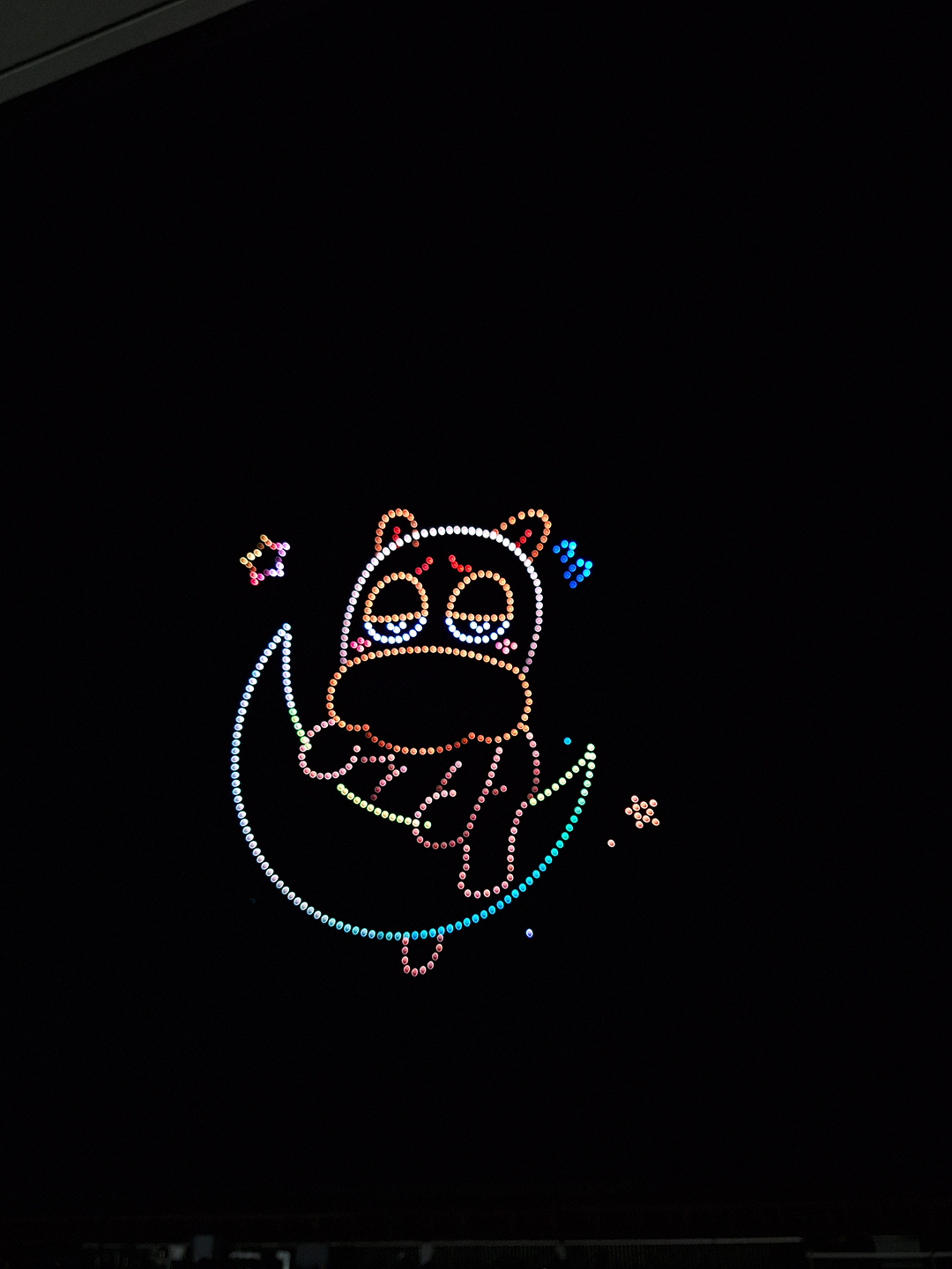 Malma created by drones, sitting on a moon with stars twinkling around