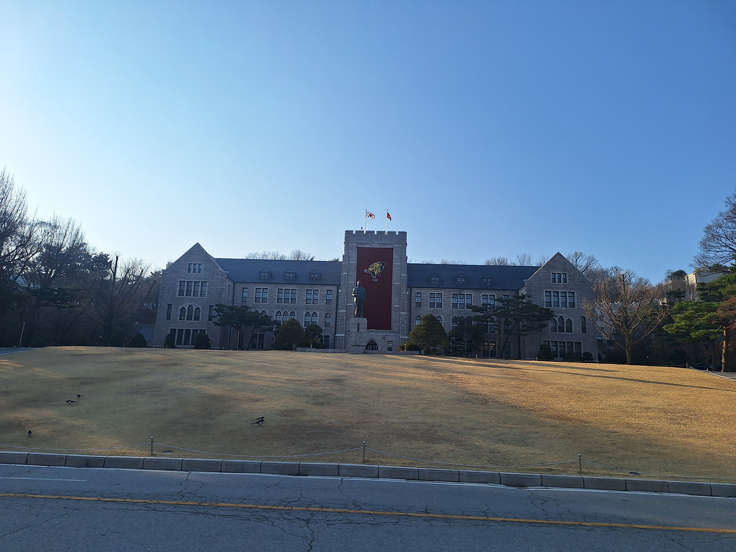 Main Administration of Korea University with a KU banner in front