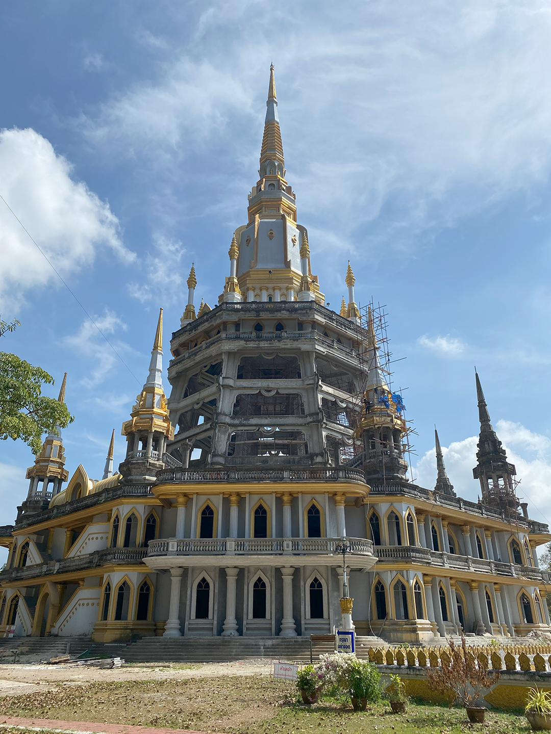 Towering temple made of stop with gold accenting