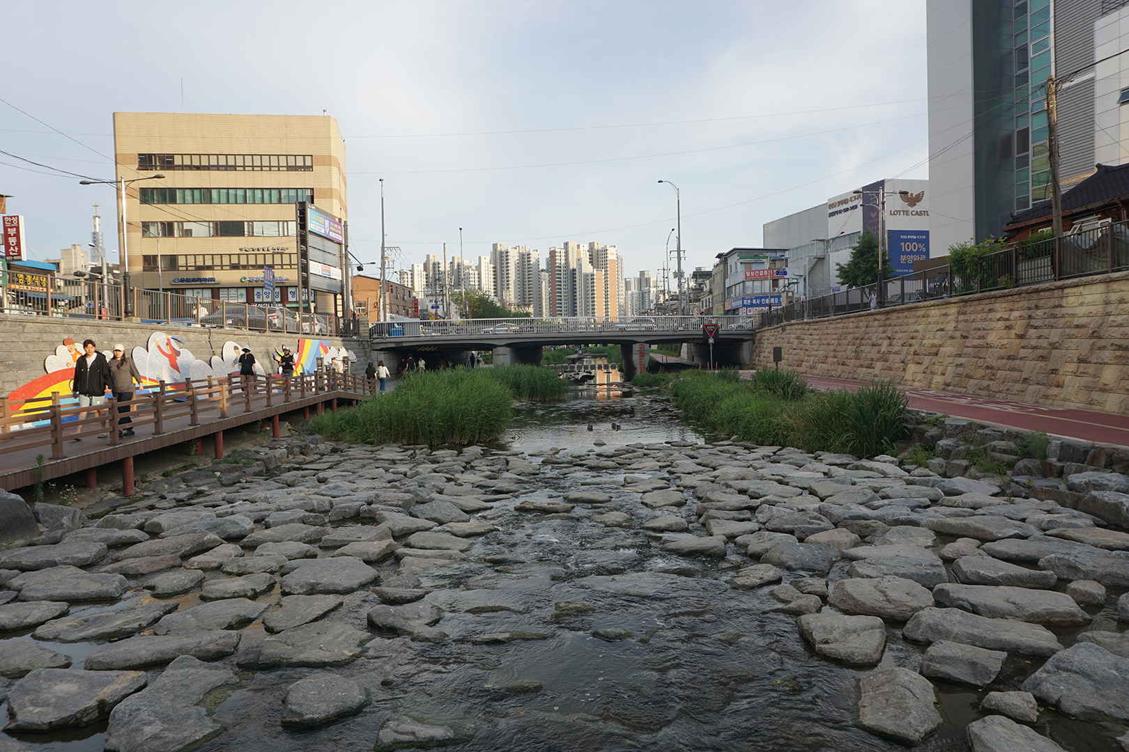 A stream lined with paths on both sides