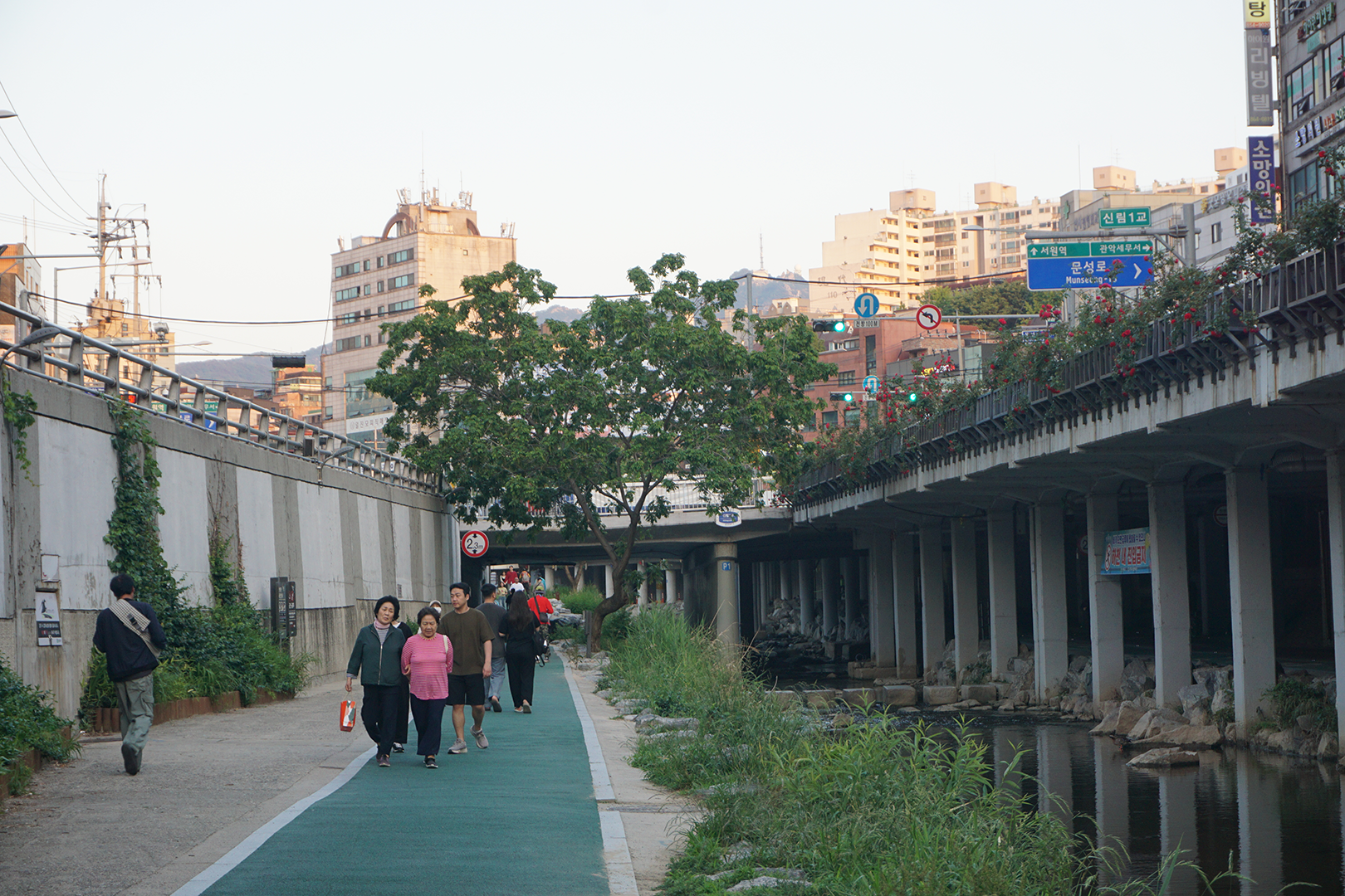 Stream located on a lower level from the surrounding roads and buildings